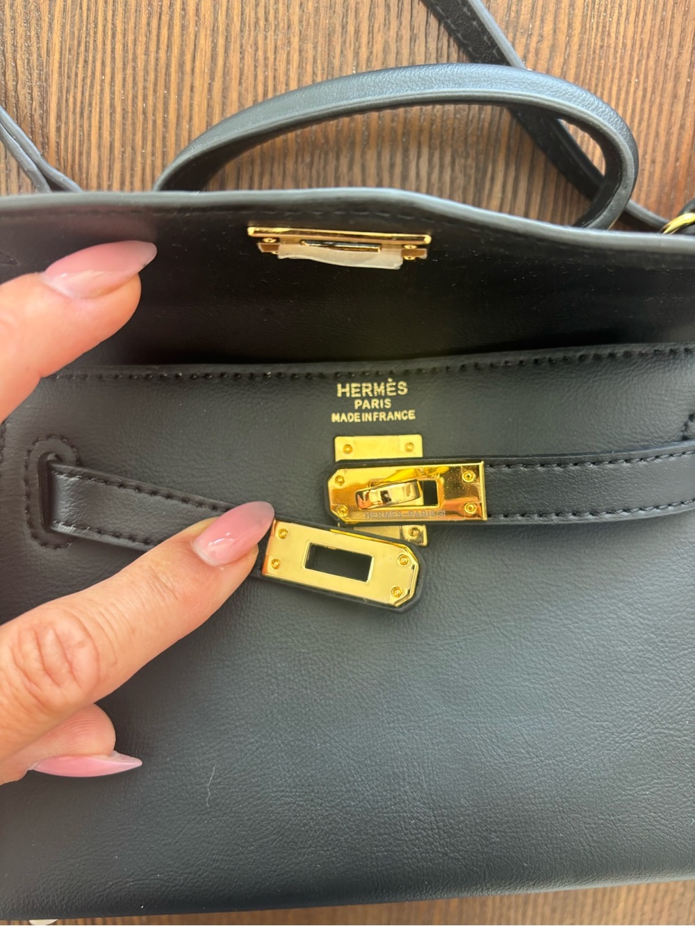 Designer inspired small Kelly black leather Handle Bag w/embossed Gold Hardware
